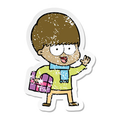 distressed sticker of a happy cartoon boy with present