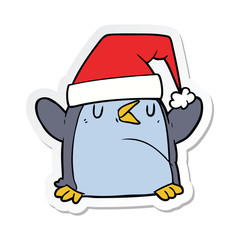 sticker of a cartoon penguin wearing christmas hat