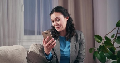Happy businesswoman using mobile phone for video call