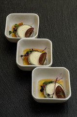 Buck goat cheese in ash with orange confit and strawberry