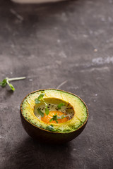 Homemade Organic Egg Baked in Avocado with Salt and Pepper