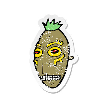recommend clip art: retro distressed sticker of a cartoon tribal mask