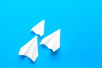 Group of paper planes  on blue background. Business for new ideas creativity and innovative solution concepts