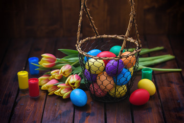 Easter background with tulips and painted eggs 