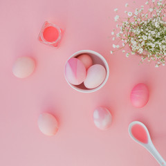Easter eggs pastel colors on pink background