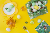Easter eggs on yellow background