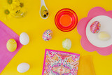 Easter eggs pink on yellow background