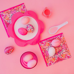 Easter eggs pastel colors on pink background