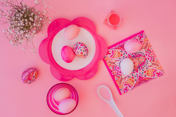Easter eggs pastel colors on pink background