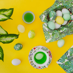Easter eggs on yellow background