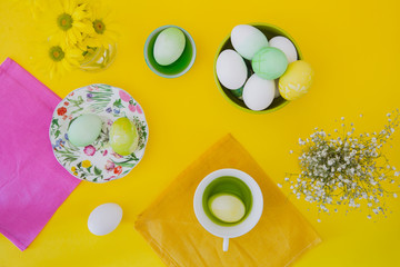 Easter eggs on yellow background