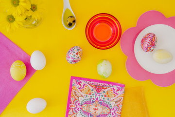 Easter eggs pink on yellow background