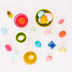 Top view of colorful easter eggs on white background