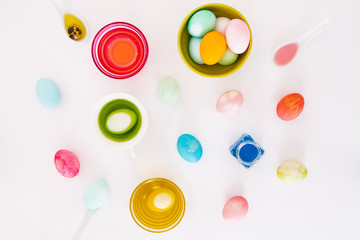 Top view of colorful easter eggs on white background