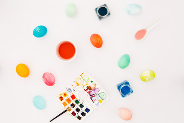 Top view of colorful easter eggs on white background