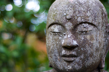 Close up picture of the stone Buddha Statue at the Eikando Temple in Kyoto, Japan