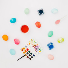 Top view of colorful easter eggs on white background