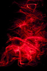 Red smoke on black background