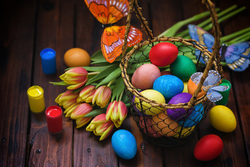 Easter background with tulips and painted eggs 