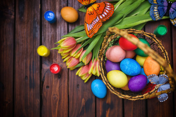 Easter background with tulips and painted eggs 