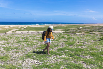 Hiker Girl with Helmet in Coastline 
