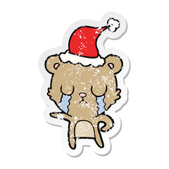 crying distressed sticker cartoon of a bear wearing santa hat