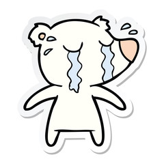 sticker of a cartoon crying polar bear