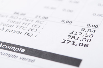 closeup of amount in euro money with taxes on french bill document