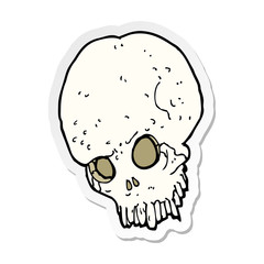 sticker of a cartoon spooky skull