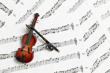 Violin and bow on paper music notes with copy space