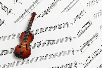 Violin on paper music notes with copy space