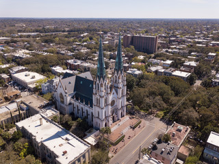 Aerial shot of historic district of Savannah, Georgia with Cathedral of St John in the foreground