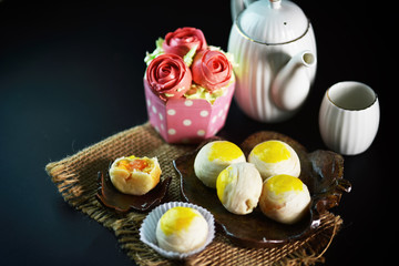 Chinese - Thai dessert Made from flour to Baking heat Mashed golden beans stuffed with salted egg yolk,Chinese festival. Traditional delicious cake in asia;