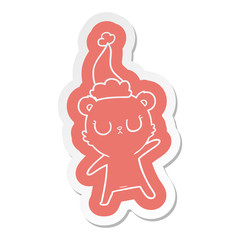 peaceful cartoon  sticker of a bear wearing santa hat