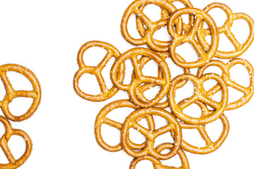 Lot of whole mini salted pretzels flatlay isolated on white background