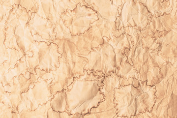 Crumpled vintage stained brown textured abstract paper background