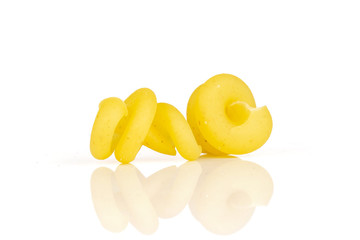 Group of two whole wheat yellow raw pasta funghetto variety isolated on white background