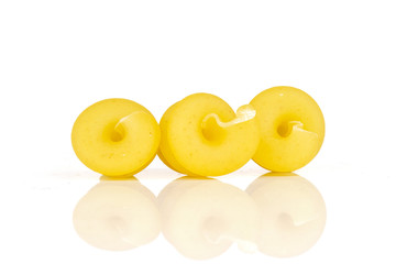 Group of three whole raw pasta funghetto variety isolated on white background