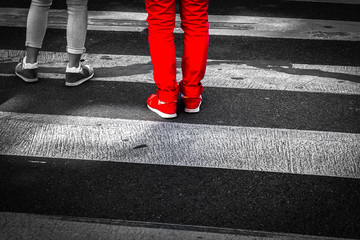 Close up of Two People Crossing a Street 