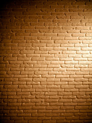 Fototapeta na wymiar Background of brown brick textured vintage wall with light pattern