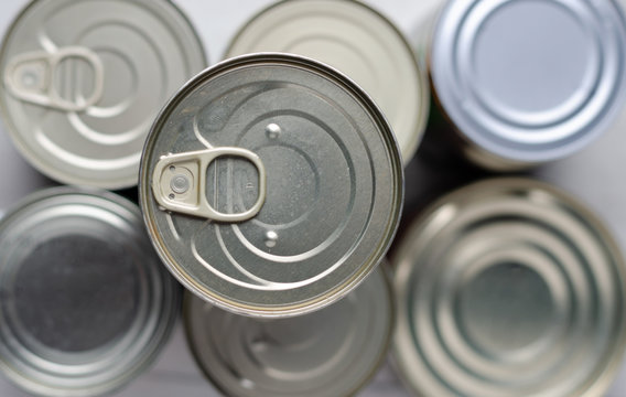 Pile Of Unopened Cans Of Conserved Food.