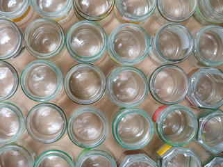 Overhead close up of empty glass jars without caps