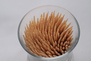 A toothpick in a dozen on a white background