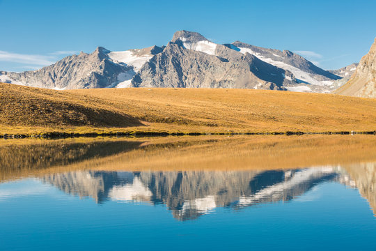 Cima del Carro and Grand Aiguille Rousse reflected in the Rosset Lake, Nivolet pass, Ceresole Reale, Gran Paradiso National Park, Piedmont region, Italy