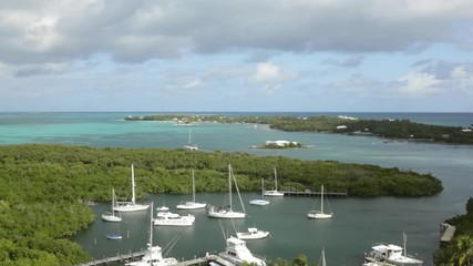 Aerial view of shore and sailboats in Elbow Cay in the Bahamas.
