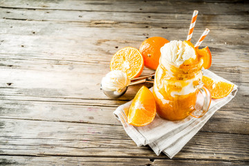 Orange Soda Creamsicle cocktail. Ice Cream and orange smoothie. Dreamsicle drink. Rustic wooden background copy space