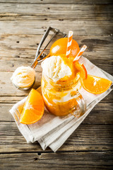 Orange Soda Creamsicle cocktail. Ice Cream and orange smoothie. Dreamsicle drink. Rustic wooden...