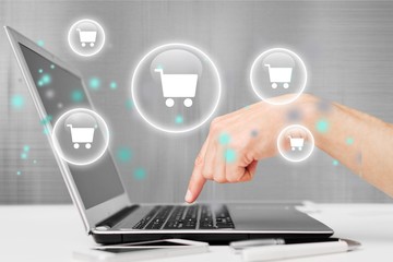 Man with laptop and credit card. On-line shopping on the internet using a laptop