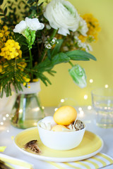 Easter celebration card close up with colored eggs in the bowl 