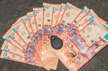 money foreign currency of the country kazakhstan tenge paper large red bills capital savings a lot of keys wealth treasure